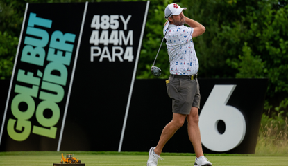 Marc Leishman strikes a tee shot with an iron