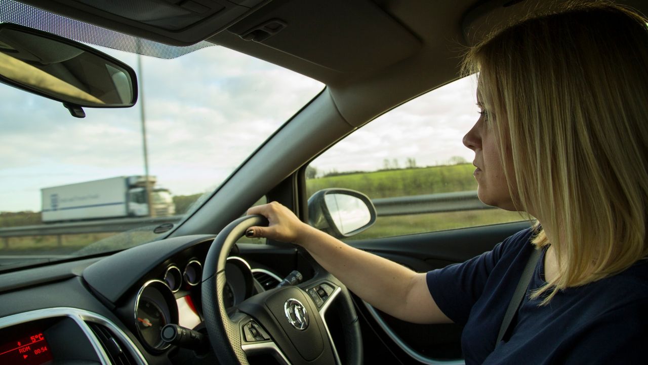 Woman driving a car, driving license