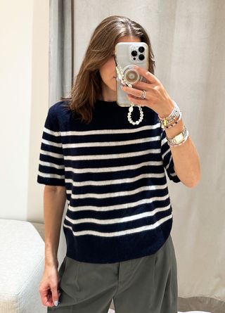 Woman in blue striped sweater.