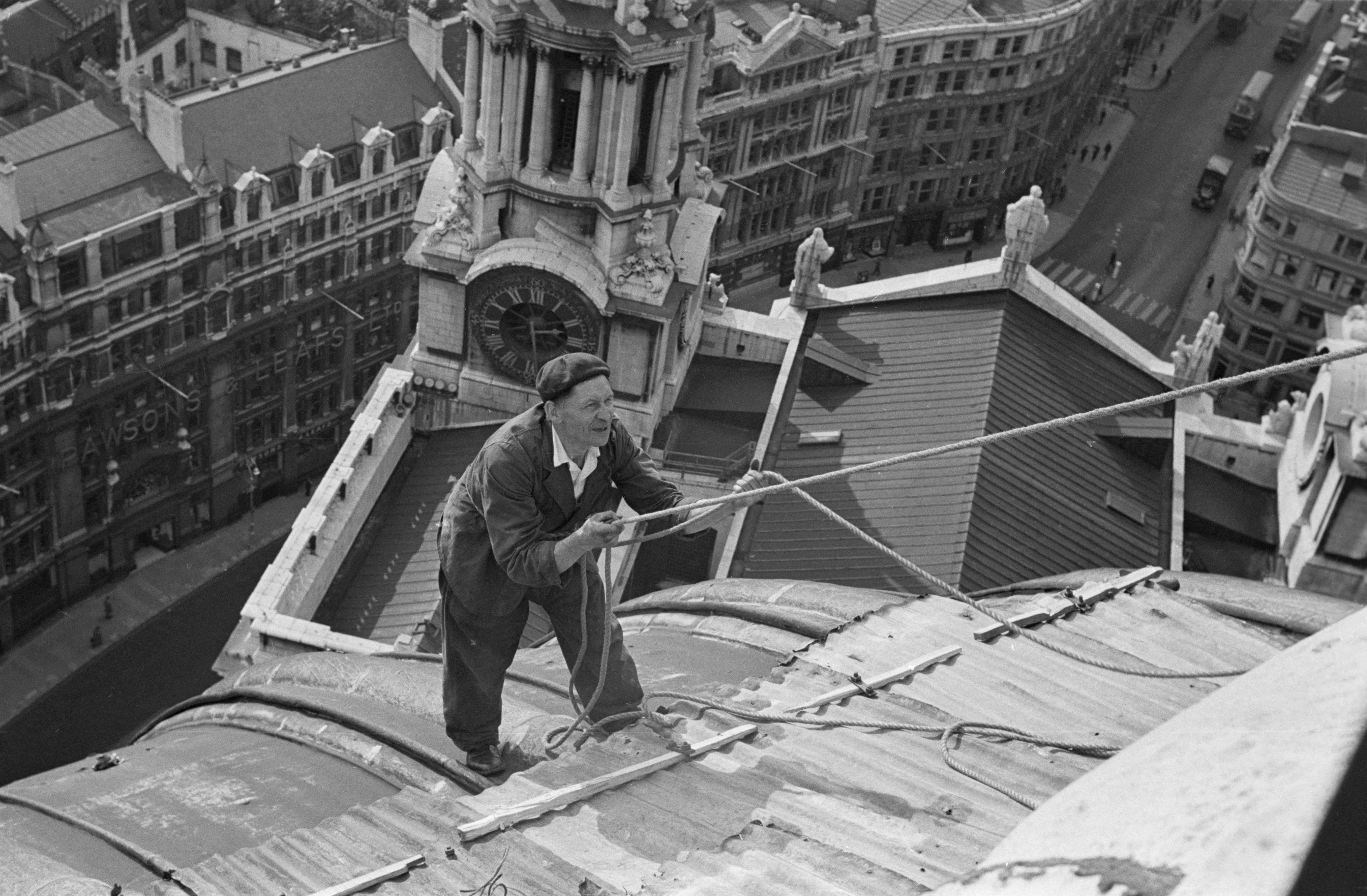 A steeplejack working on the dome of St Paul's Cathedral in London, October 1953.