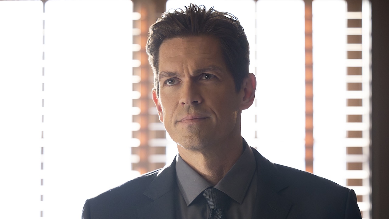 Cpt. Wagner standing in front of open blinds in his office in High Potential Season 2