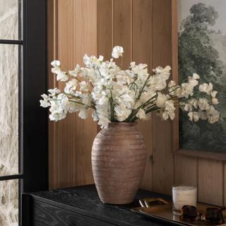 A console table with a vase from McGee & Co.