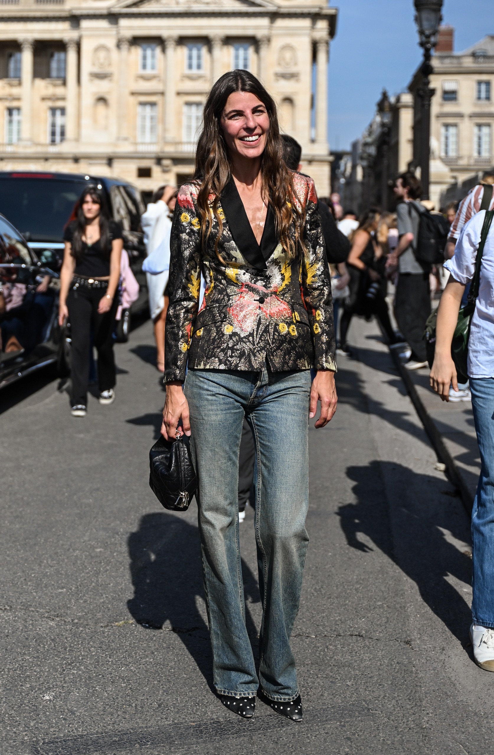 woman wearing brocade jacket and jeans
