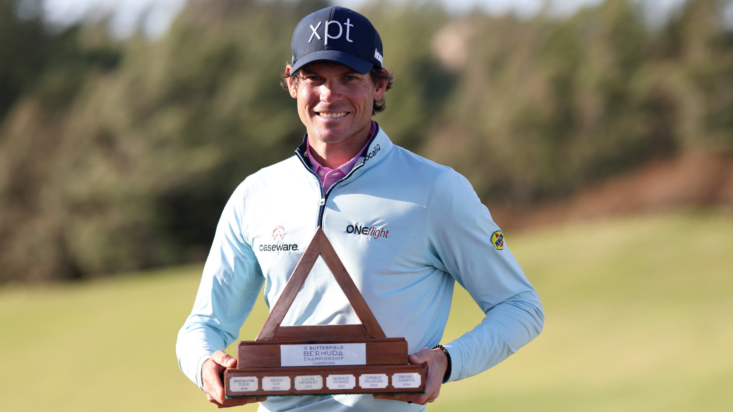 Adam Schenk with the Butterfield Bermuda Championship trophy