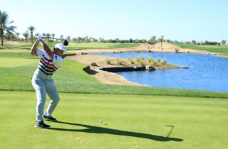 DeChambeau hits a tee shot