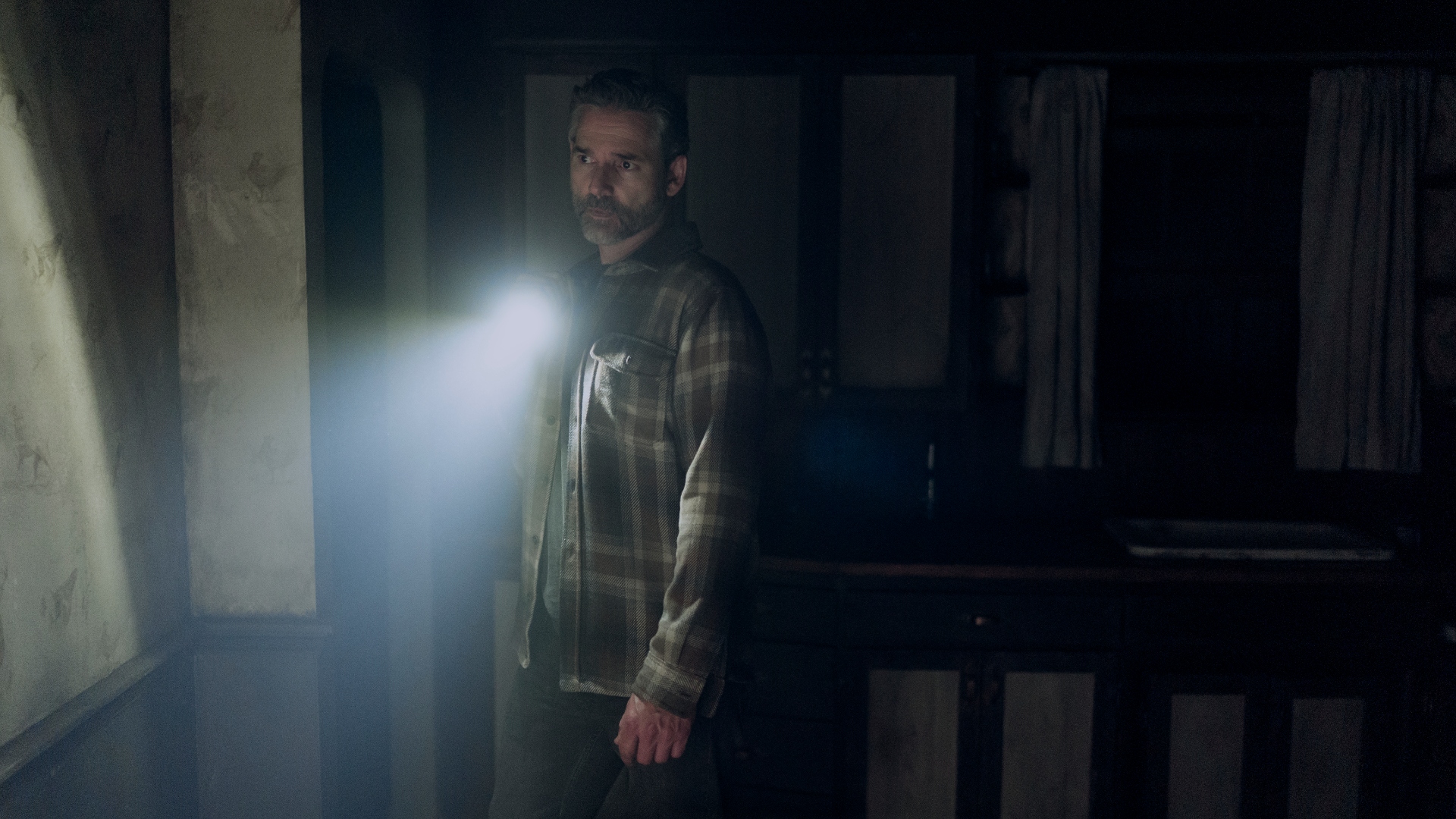 Kyle uses a flashlight in Untamed