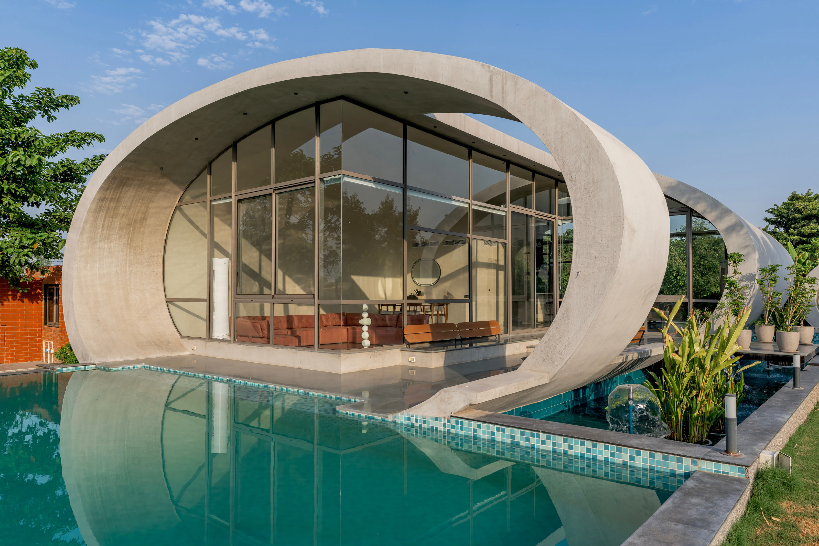 The house overlooks a pool