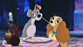 A charming scene from Lady and the Tramp, where Lady and Tramp share a plate of spaghetti under the stars, their noses almost touching as they enjoy the meal together.