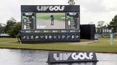 A LIV Golf screen and sign on a lake at the LIV Golf Houston tournament in 2024