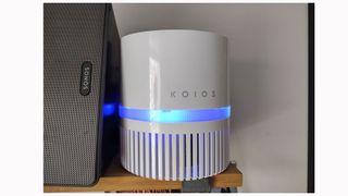 Image shows the KOIOS EPI810 on a shelf next to a portable speaker.