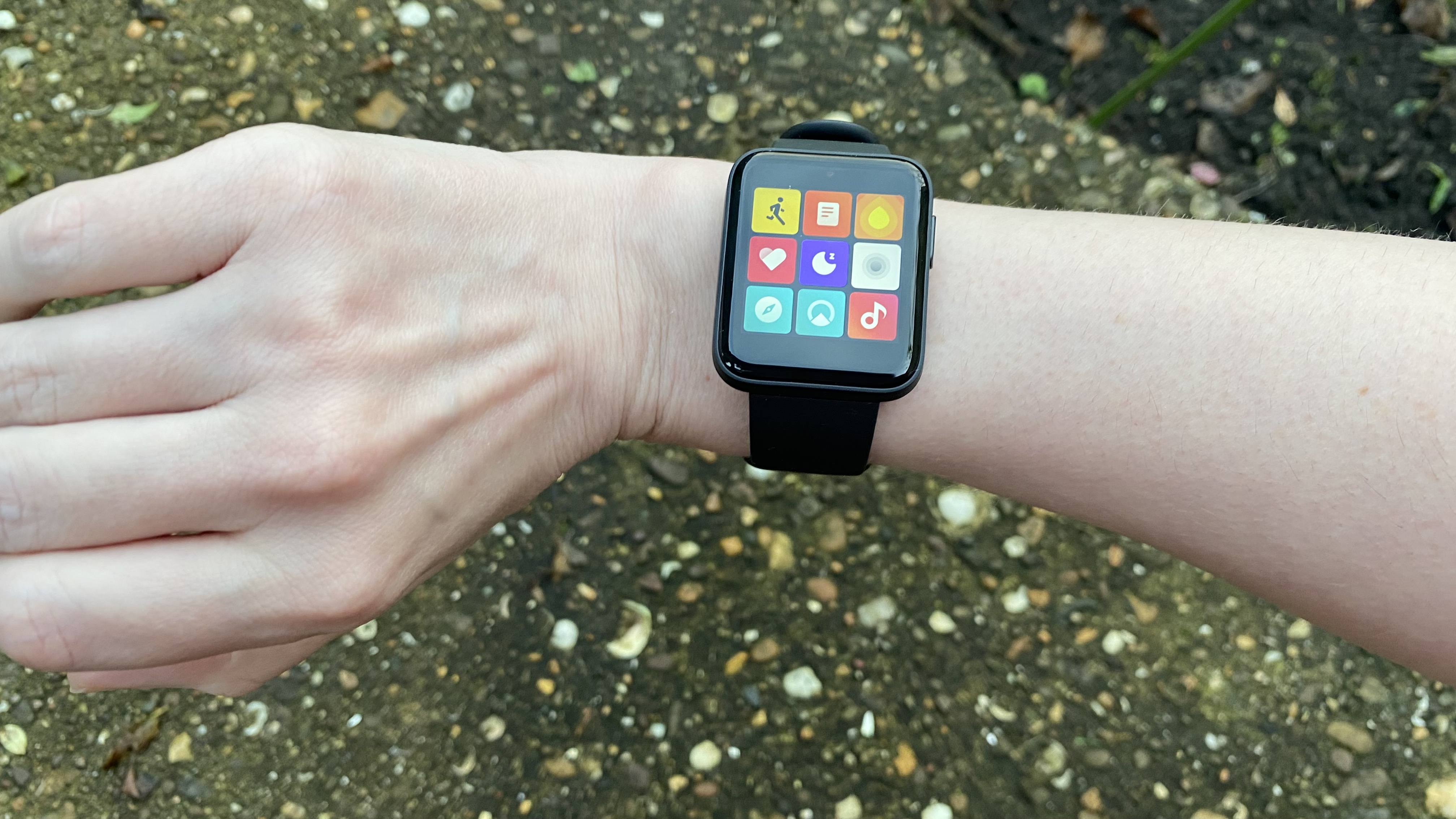 A Xiaomi Mi Watch Lite on someone's wrist