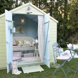 garden shed with chair and long curtain