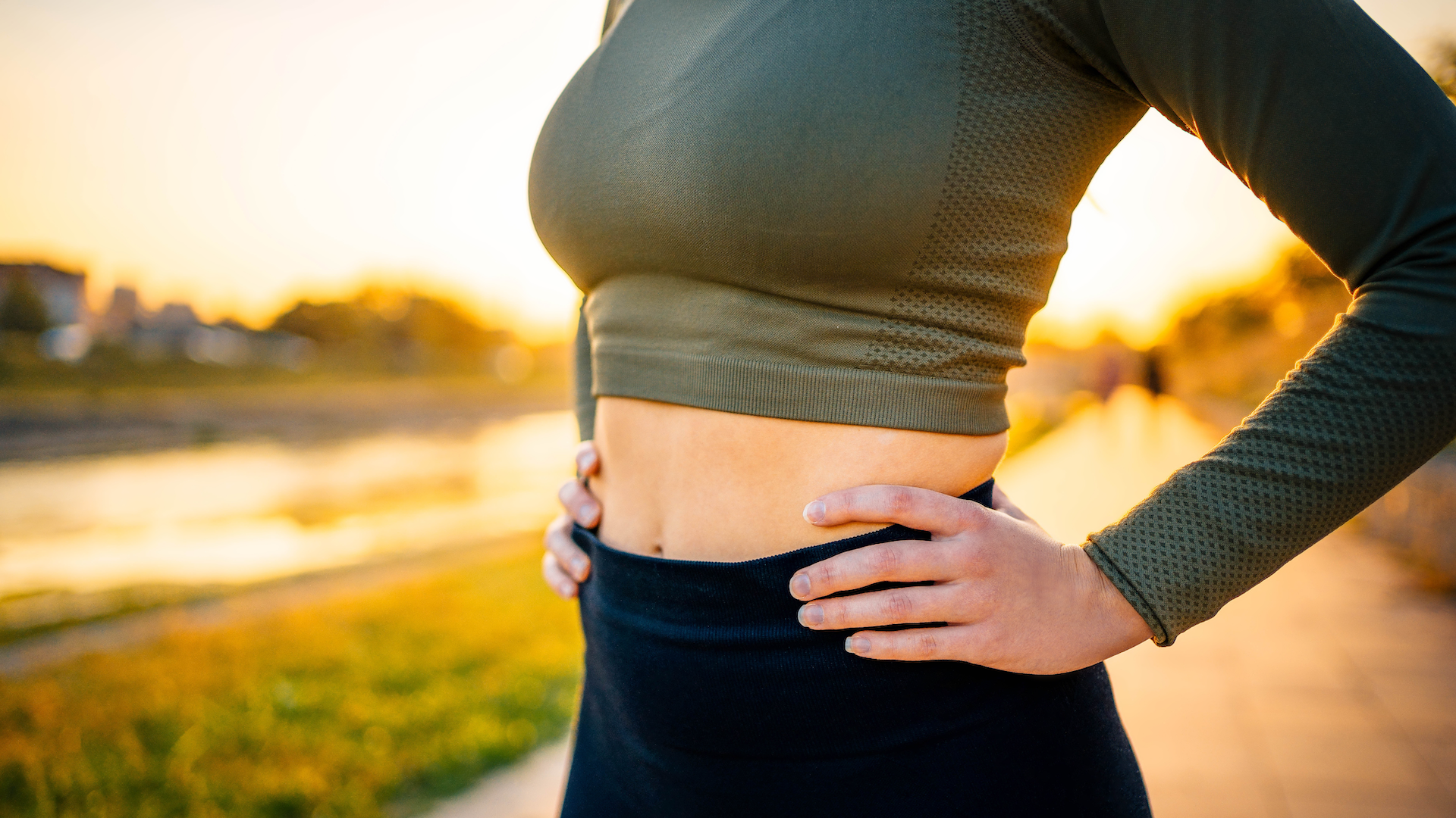 Woman holding her waist during a run