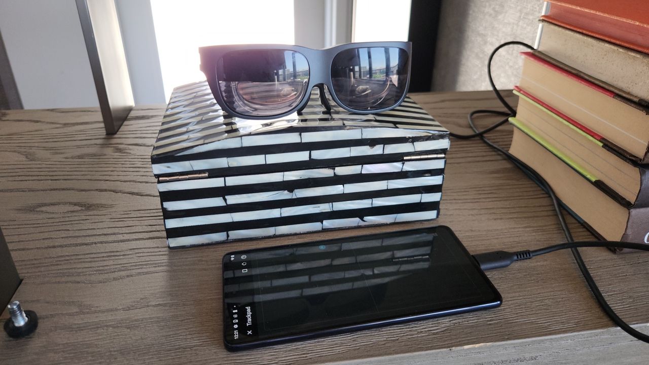 Lenovo Glasses T1 and Motorola Edge phone with trackpad controls