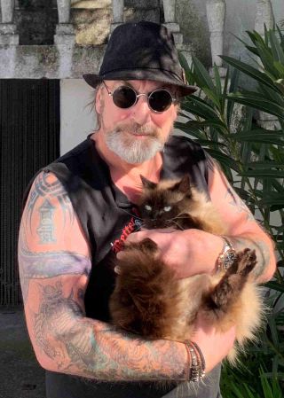 Mantas of Venom Inc with his cat Sharon
