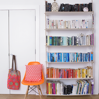 white wall with bookshelves
