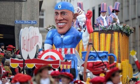 A carnival float in Cologne Germany depicts President Obama as comic book hero Captain America