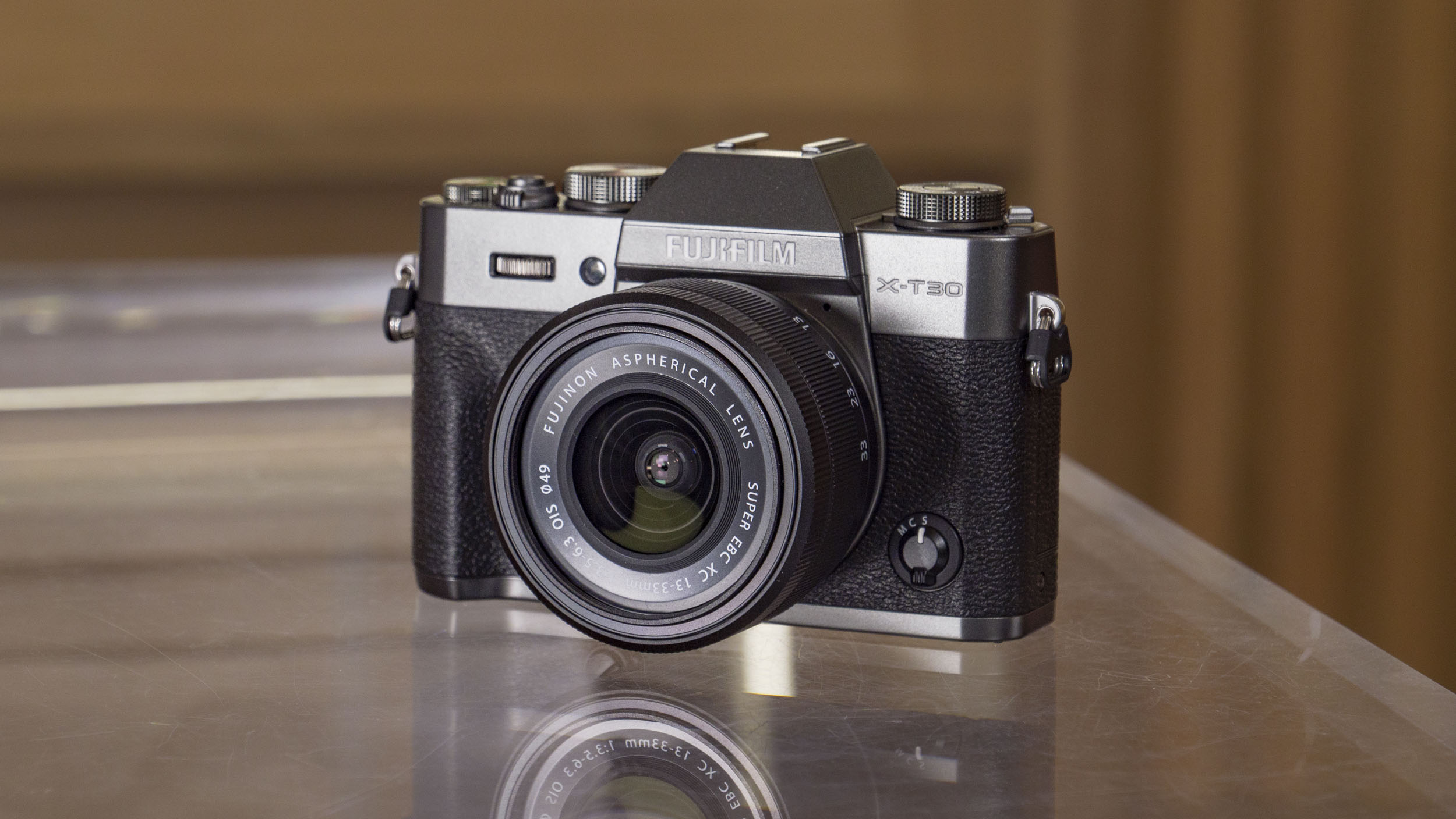Fujifilm X-T30 III camera on a glass table