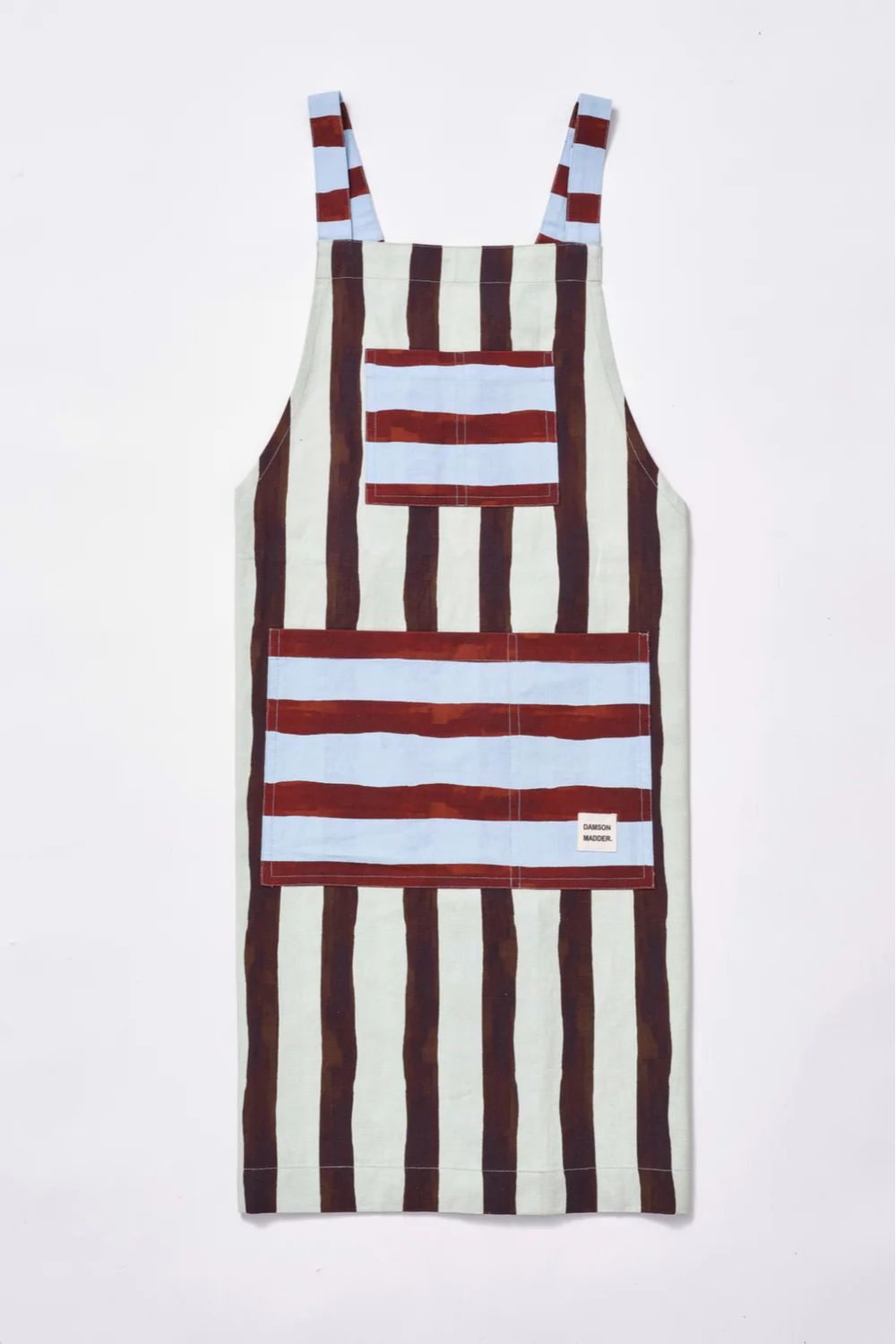 Apron with white and brown stripes and two blue and burgundy striped pockets