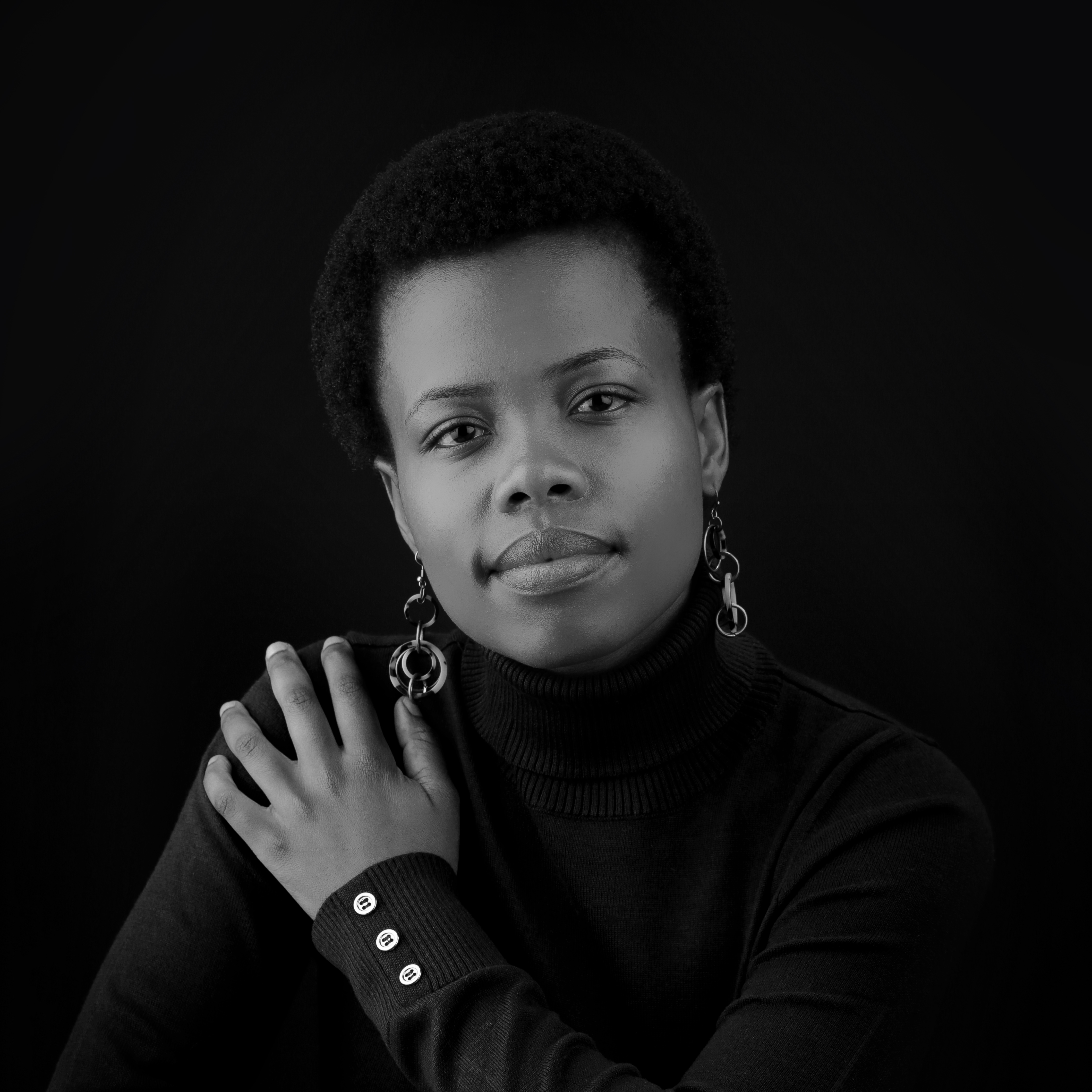 woman wearing black on a dark background