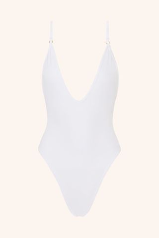 A white one-piece swimsuit with plunging neckline