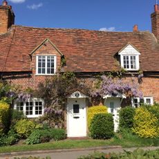 sloping roof house with white windows