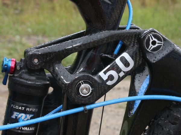 The new carbon fiber upper link is held in place with all-new hardware.