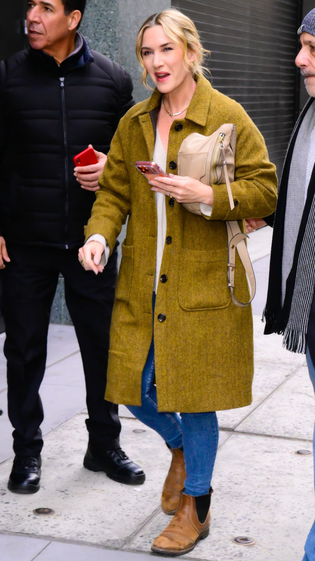 Kate Winslet wearing skinny jeans and chelsea boots on December 10, 2025 in New York City