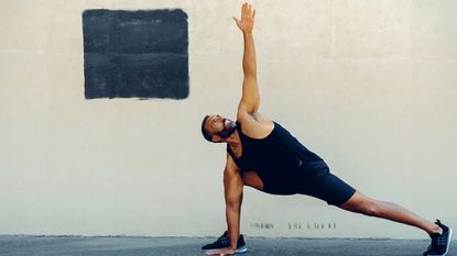 Man practicing yoga outside