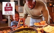 Toby Carvery logo placed over an image of a father and daughter self servicing at a Toby restaurant 