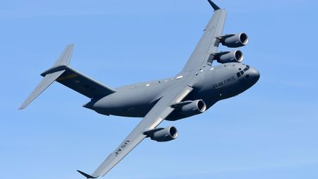 a large grey airplane in the sky