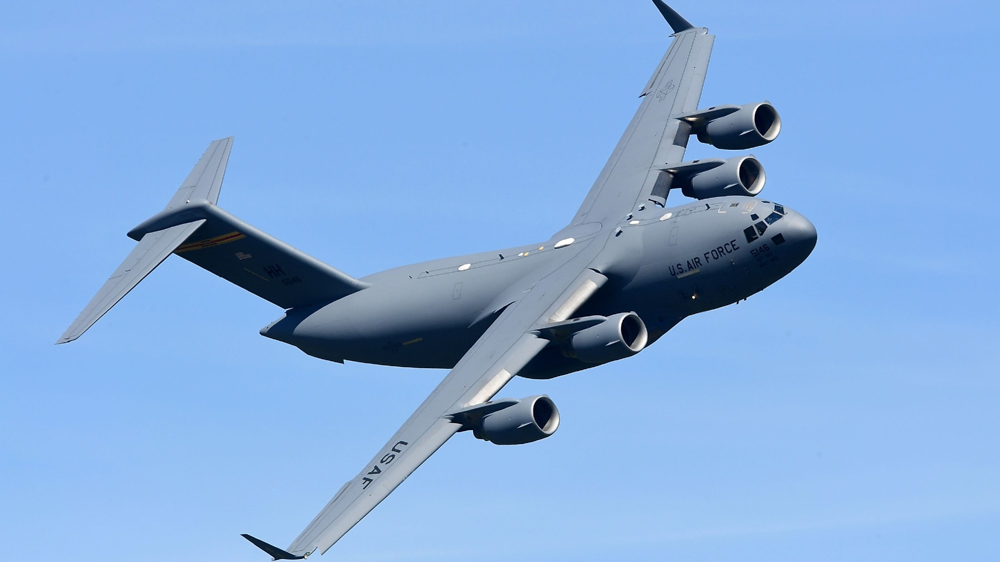 a large grey airplane in the sky