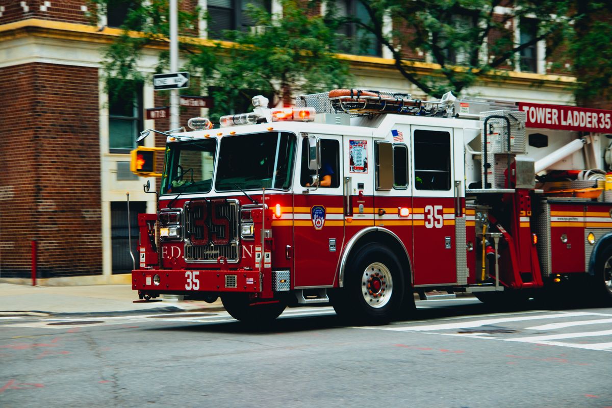 Fire truck driving down a city street