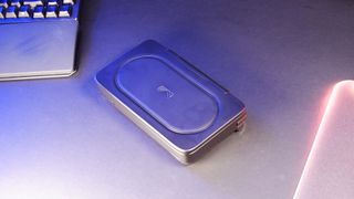 An Ayaneo Flip DS running a game while sat on a desk.