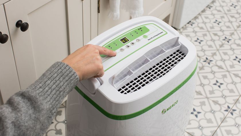 Person switching on Meaco dehumidifier