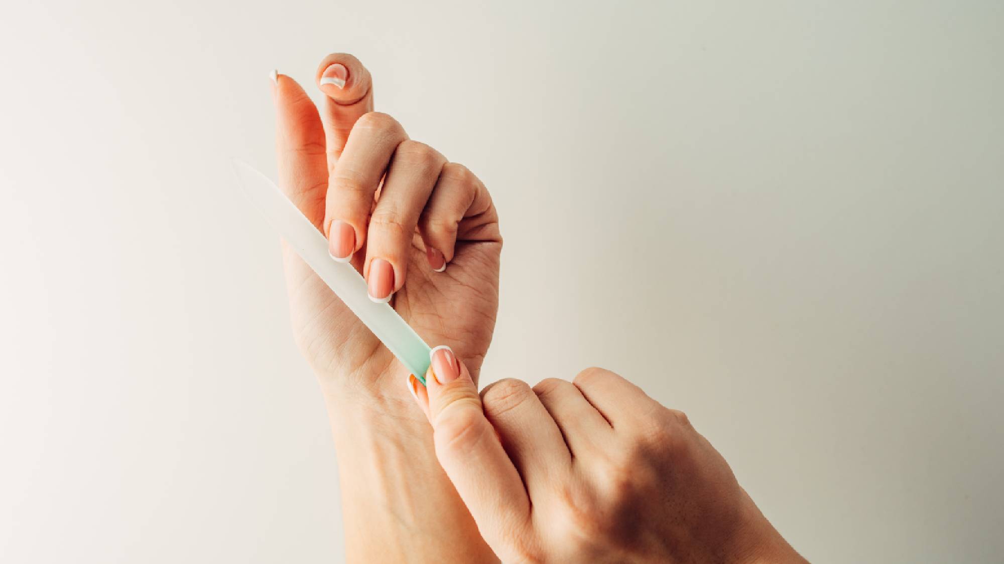 Filing nails with a glass nail file