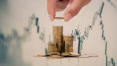 Digital Composite Image Of Hand Stacking Coins On Table