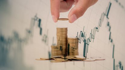 Digital Composite Image Of Hand Stacking Coins On Table