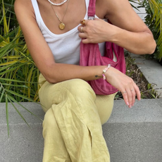 woman wearing white sneakers with spring outfit