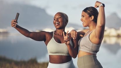 Two women in sports clothing taking a selfie.