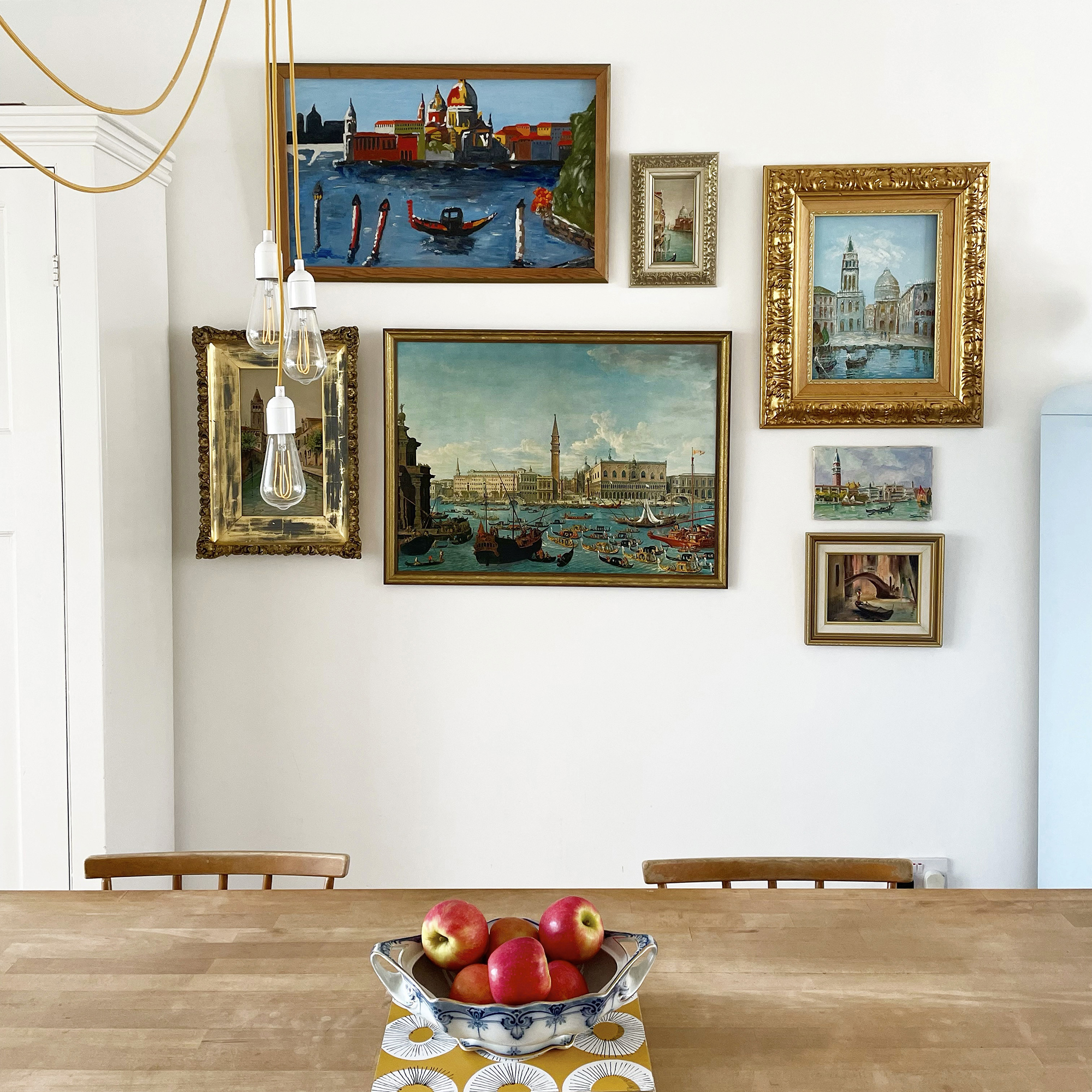 dining table with bowl of apples on it