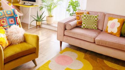 Yellow color scheme living room with pink couch