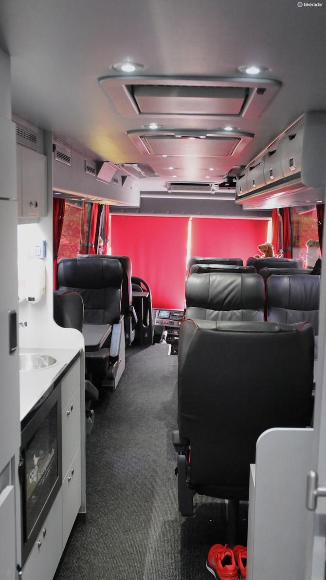 The ceiling incorporates two fold-down screens for watching TV or films throughout the bus