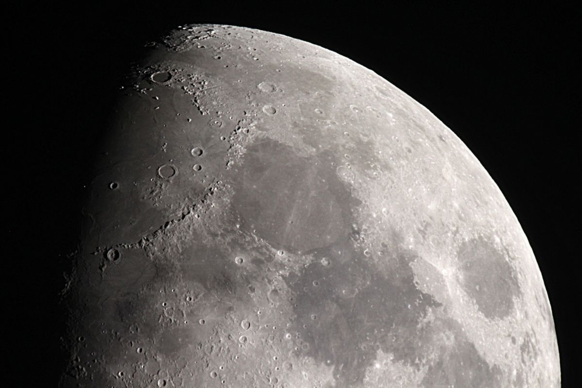 A piece of the moon against a black sky