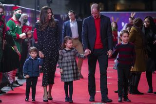 Prince William, Duke of Cambridge and Catherine, Duchess of Cambridge with their children, Prince Louis, Princess Charlotte and Prince George, attend a special pantomime performance