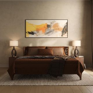 bedroom with bedside lamps and large artwork about bed