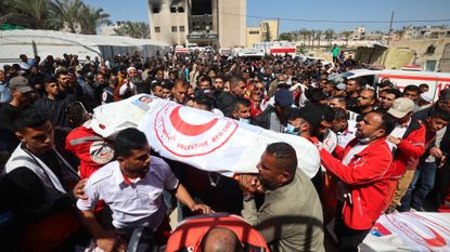 Palestinians mourn the killing of 14 Gaza medics and 1 U.N. employee in Israeli attack