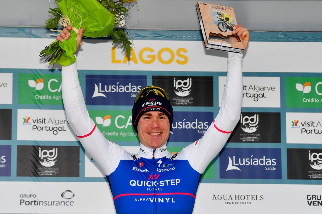 LAGOS PORTUGAL FEBRUARY 16 Fabio Jakobsen of Netherlands and Team QuickStep Alpha Vinyl celebrates winning the stage one on the podium ceremony after the 48th Volta Ao Algarve 2021 Stage 1 a 1991km at stage from Portimo to Lagos VAlgarve2022 on February 16 2022 in Lagos Portugal Photo by Luc ClaessenGetty Images