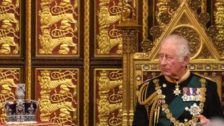 Prince Charles, Prince of Wales looks towards the Imperial State Crown as he delivers the Queen’s Speech during the state opening of Parliament at the House of Lords on May 10, 2022 in London, England.