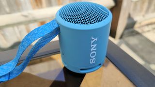 Sony SRS-XB13 review: speaker outside on a table